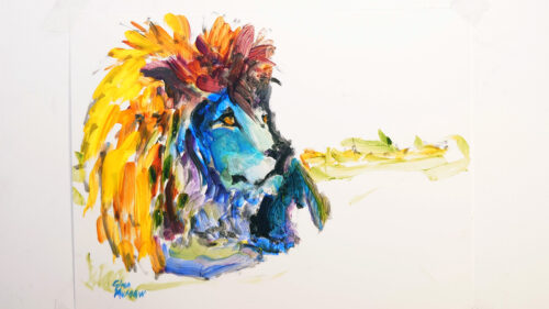 A male lion painted in a rainbow of oil paint colors